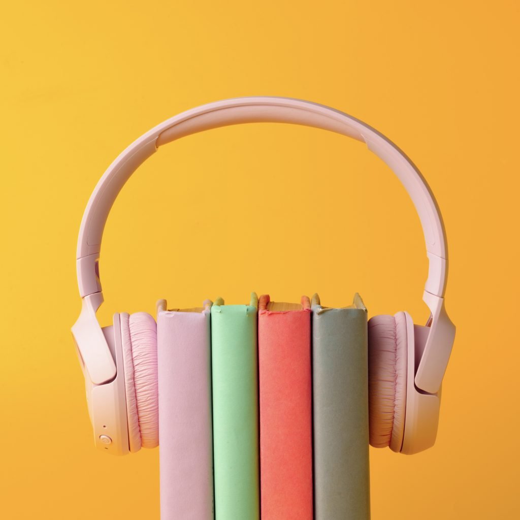 Stack of books with headphones on